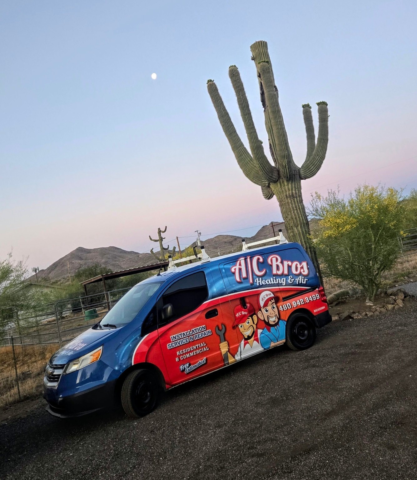 A/C Bros van beside a saguaro cactus